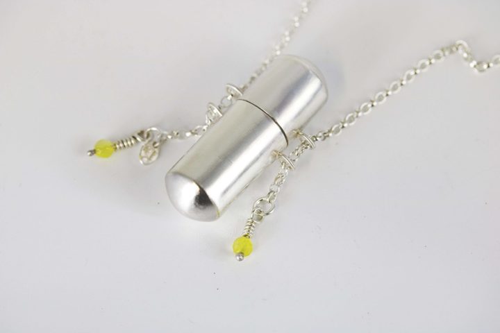 Touchstone capsule locket